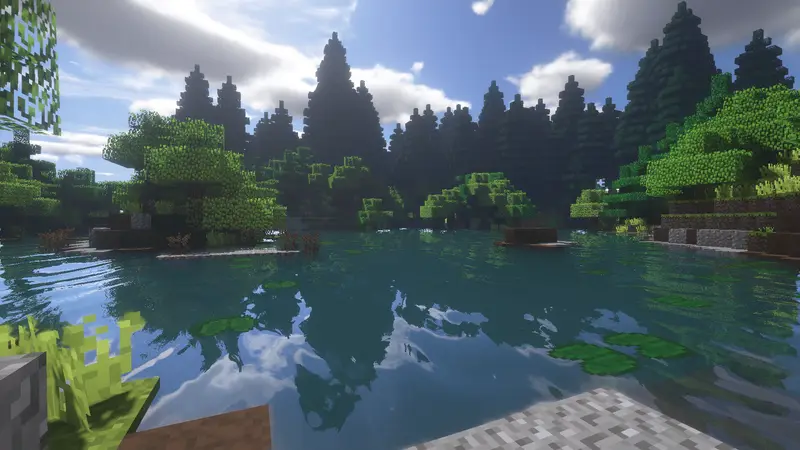 A still lake ringed by dark pines